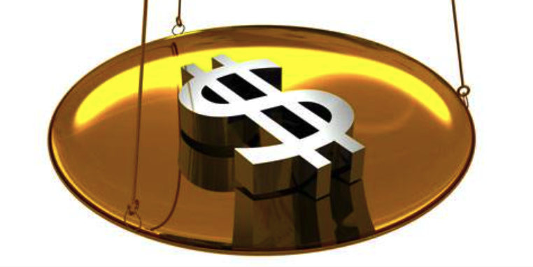 Gold Declines Under Pressure from Fed's Forecasts